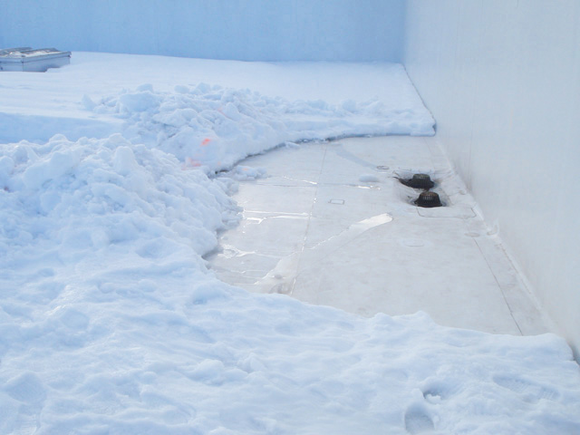 Clearing Ice from rooftop drains